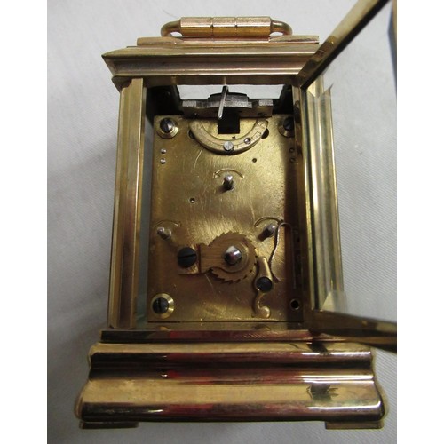 51A - C20th miniature lacquered brass carriage clock with white enamel dial and subsidiary dials for day a... 