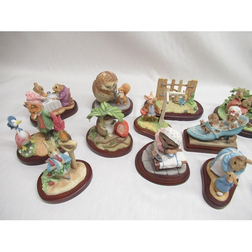 36 - Fourteen Border Fine Arts and Enesco Beatrix Potter figurines on bases, including 