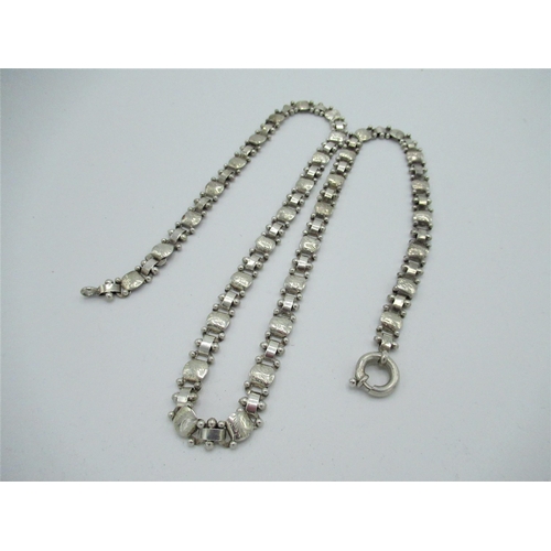 5 - Hallmarked Sterling silver chain with bright cut decoration to panels joined to articulated chain wi... 