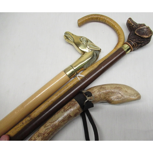 500 - Modern walking stick with cast brass handle in the form of a horses head and three other walking sti... 