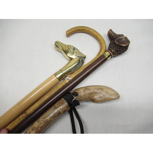 500 - Modern walking stick with cast brass handle in the form of a horses head and three other walking sti... 