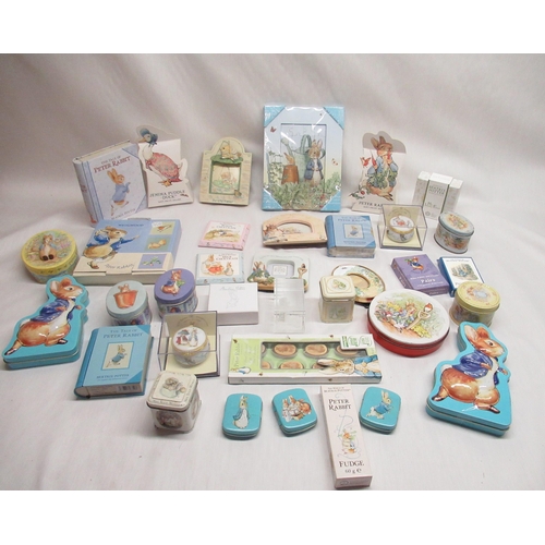 51 - Collection of boxed Peter Rabbit sweets and mints, paperweights, playing cards, etc