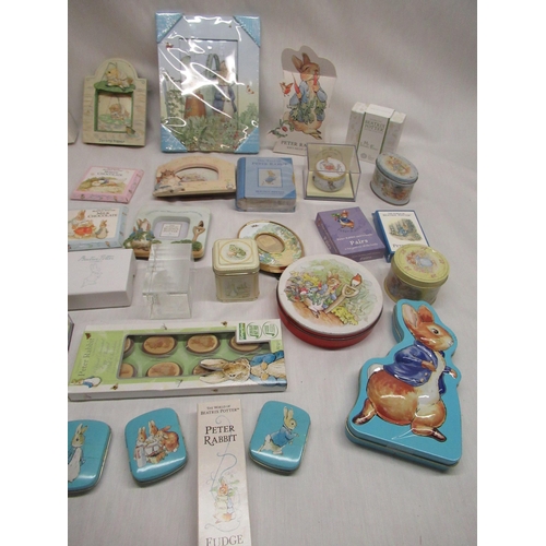 51 - Collection of boxed Peter Rabbit sweets and mints, paperweights, playing cards, etc