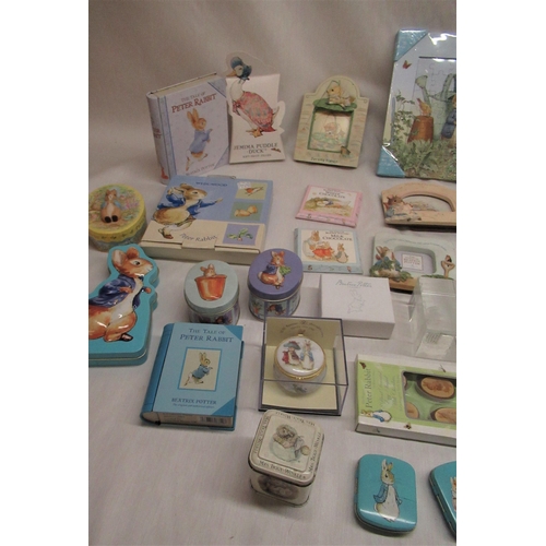 51 - Collection of boxed Peter Rabbit sweets and mints, paperweights, playing cards, etc