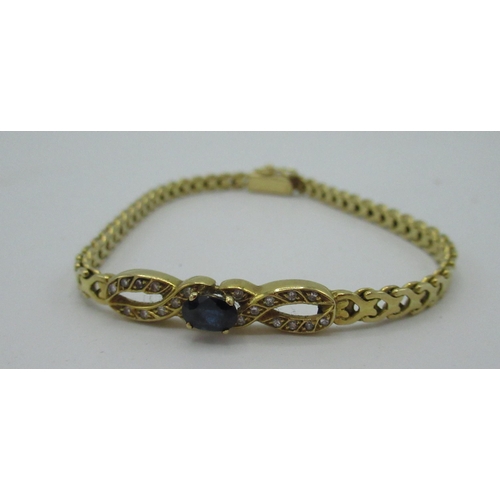524 - Gold (unmarked) articulated bracelet with central sapphire and diamonds set in infinity shaped mount... 