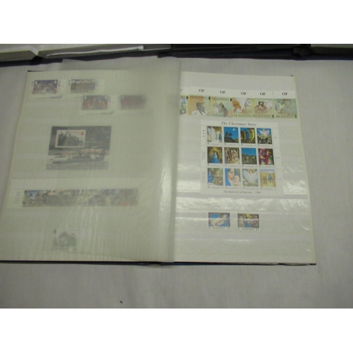 70 - Three stamp albums relating to Guernsey and Alderney