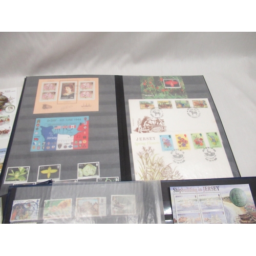 71 - Four stamp albums relating to Jersey