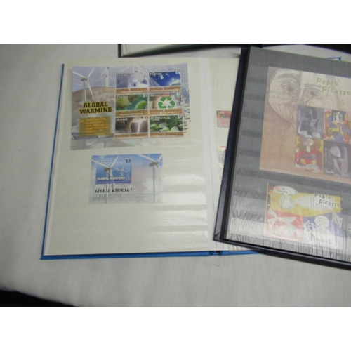 78 - Six stamp albums relating to Tuvalu