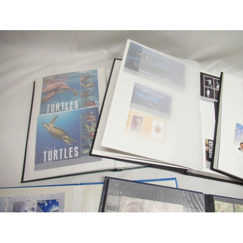 78 - Six stamp albums relating to Tuvalu