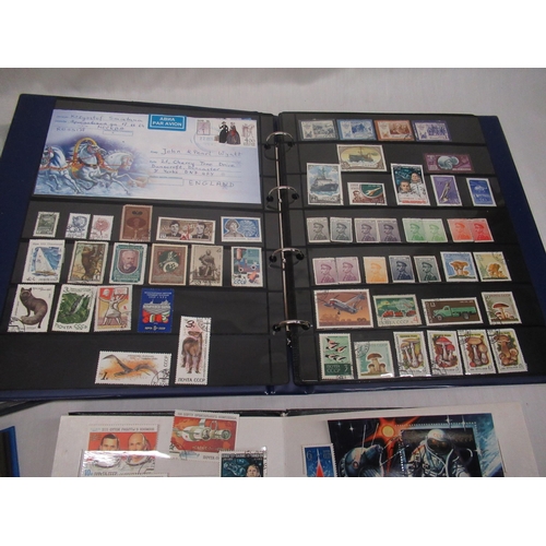 80 - Four stamp albums relating to Russia, Soviet Union, DDR, and the SAAR Protectorate