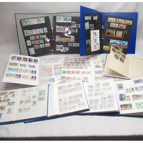 90 - Nine stamp albums relating to Iraq, Saudi Arabia, Turkey, Ajman, Yemen, Pakistan, Iran, Jordan etc