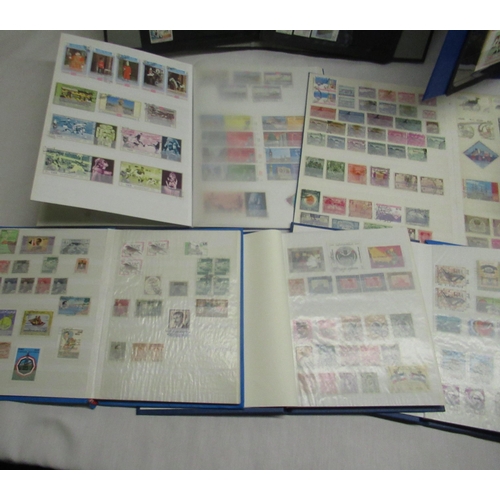 90 - Nine stamp albums relating to Iraq, Saudi Arabia, Turkey, Ajman, Yemen, Pakistan, Iran, Jordan etc