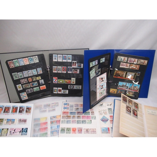 90 - Nine stamp albums relating to Iraq, Saudi Arabia, Turkey, Ajman, Yemen, Pakistan, Iran, Jordan etc