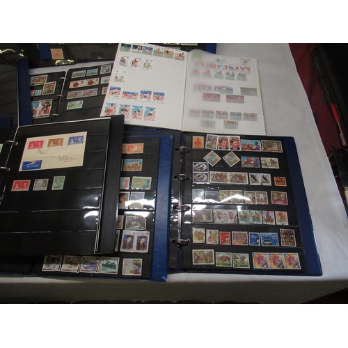 91 - Ten stamp albums of mixed international postage stamps