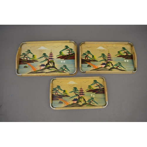 24 - Set of three small Chinese lap trays painted with eastern scenes, a Japanese Katana style and Europe... 