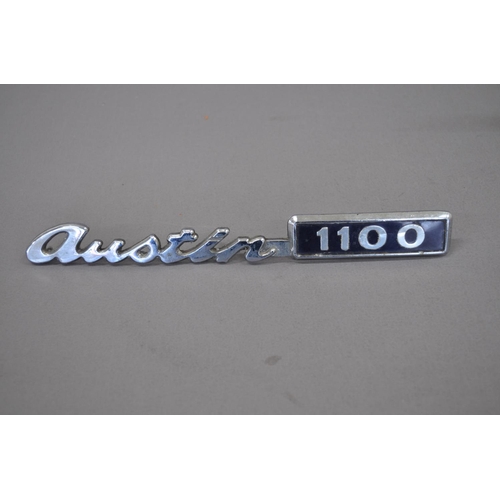 36 - Large painted grey trunk made in England (AF missing handle) and vintage Austin 1100 car badge (2)