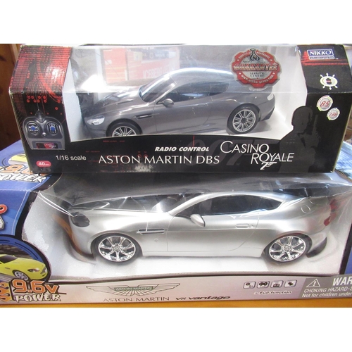 96 - Boxed Casino Royale Aston Martin DBS remote control car 1:16 scale, and a boxed as new Aston Martin ... 