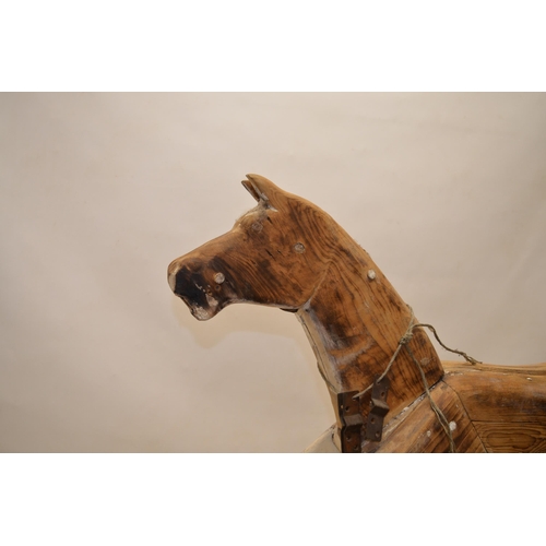 52 - Carved wood striped rocking horse figure with swing rocker type base