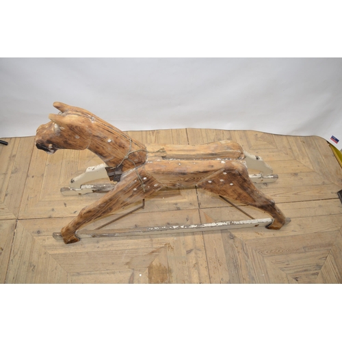 52 - Carved wood striped rocking horse figure with swing rocker type base