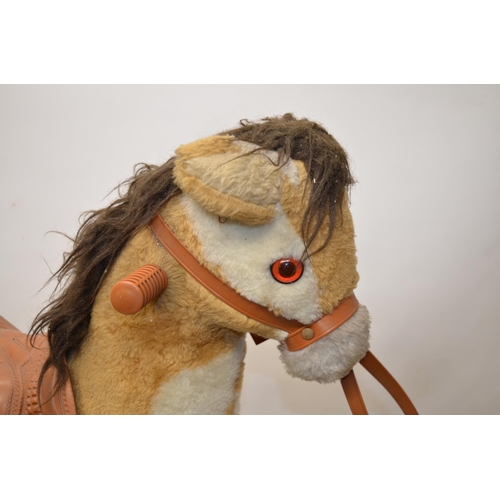54 - Small Childs Fur-Lined Rocking Horse,with Plastic Saddle,Reins and Hinged Wheels,90cm Long,40 cm Wid... 