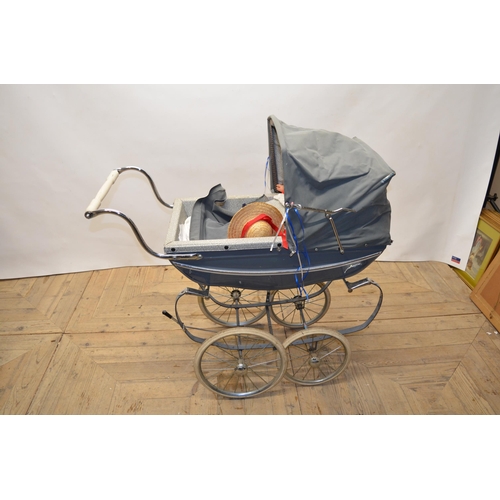 57 - Vintage Silver cross four wheel perambulator with metal body work with coloured plastic trim L97cm W... 