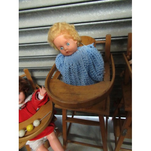 63 - Three light wood dolls highchairs and a selection of dolls