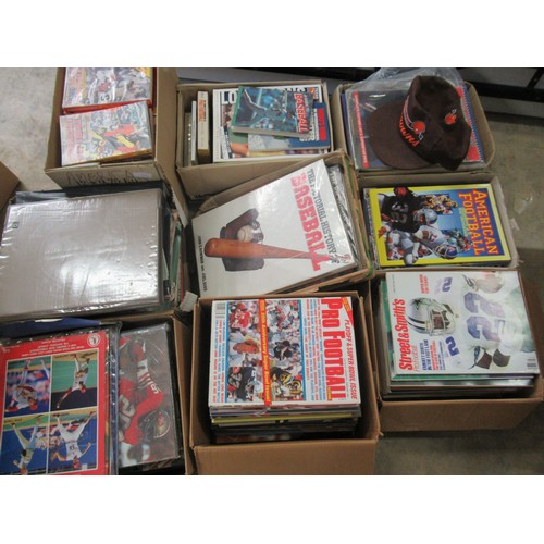 306 - Nine boxes of American football and baseball books, programmes and Cleveland Browns hat