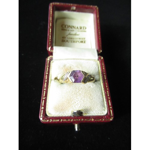 106 - 18ct gold amethyst ring set with octagonal amethyst, and six diamonds hallmarked stamped 750 Sheffie... 
