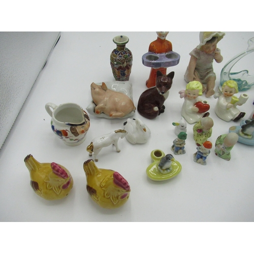 184 - Royal Crown Derby bird paperweight, gold capped, and a collection of small figures