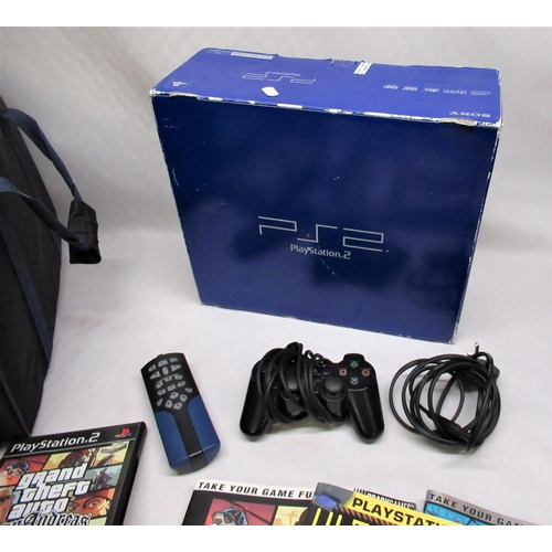 187 - Boxed PS2 and Logik, qty of games and guides