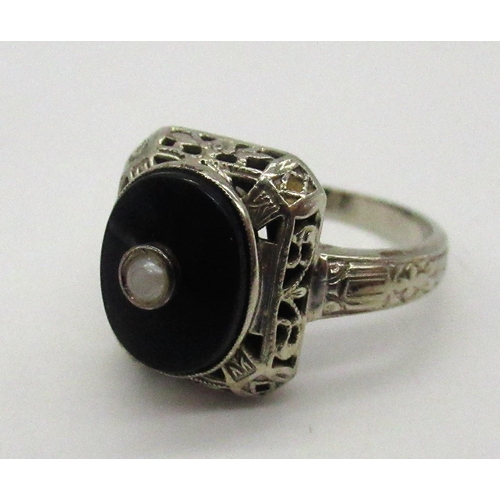 78 - 14ct white gold onyx and seed pearl ring stamped 14K, size J, 1/2 gross 2.8g