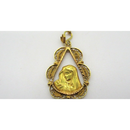 79 - 18ct yellow gold religious pendant in filigree tear drop mount L3cm on a chain with spring ring clas... 