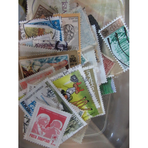 539 - Collection of loose world stamps, mostly used, and collection of Stanley Gibbons Adventure and Trust... 
