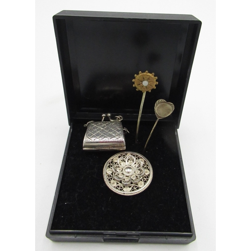 39 - Filigree white metal brooch, miniature white metal handbag and two stick pins (4)