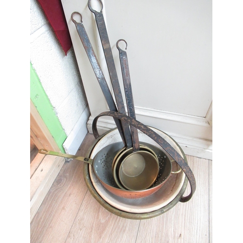 612 - Brass jam pan, copper cullender, stoneware mixing bowl and a set of three brass measured ladles