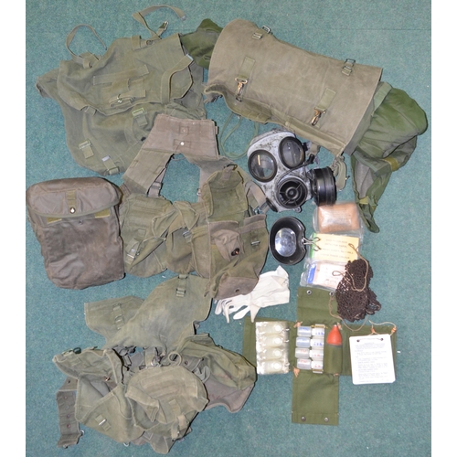 86 - Collection of 1958 pattern British Army webbing and back packs, rolled up NBC smock and trousers, NB... 