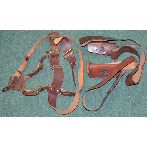 87 - Three British Army brown leather Bandelier shoulder belts and cartridge belts