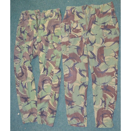 89 - Two British Army field jackets with woodland camo effect, pair of olive green military trousers, two... 