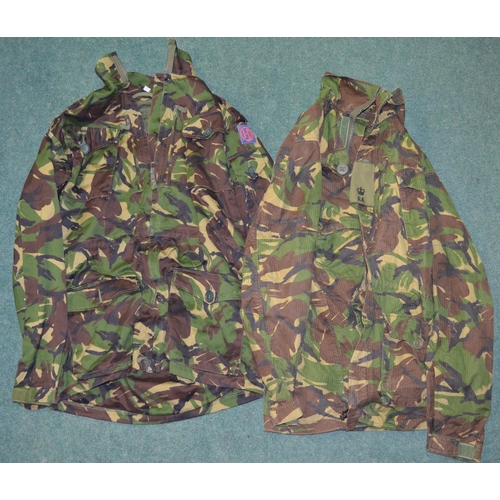 89 - Two British Army field jackets with woodland camo effect, pair of olive green military trousers, two... 