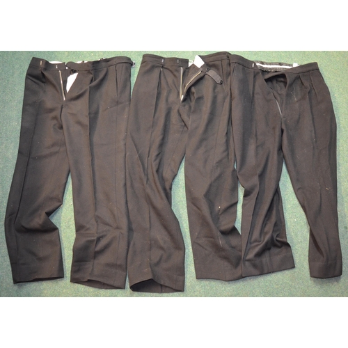 97 - Eight pairs of military trousers, three pairs of plain black dress trousers, three pairs of dress tr... 