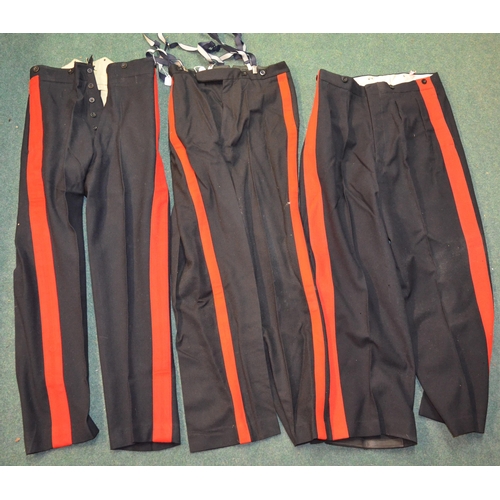 97 - Eight pairs of military trousers, three pairs of plain black dress trousers, three pairs of dress tr... 