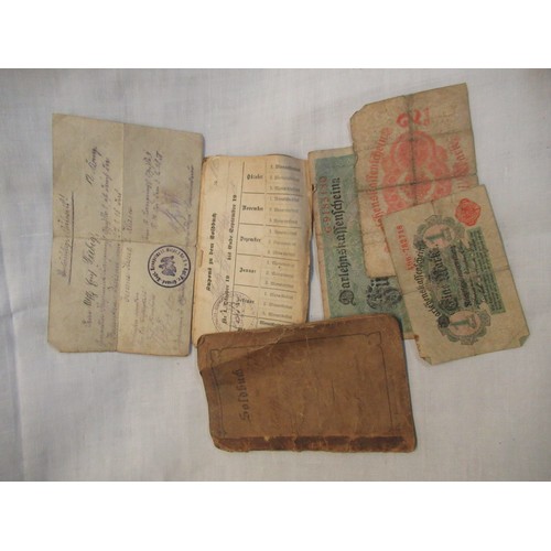 49 - German WWI Iron Cross with associated paperwork including various Imperial German paper notes, handw... 
