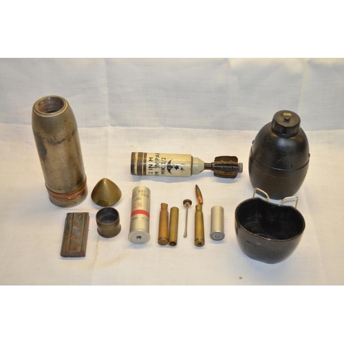 181 - Collection of expended and deactivated military shell casings, vintage gun magazine, screw top oil b... 