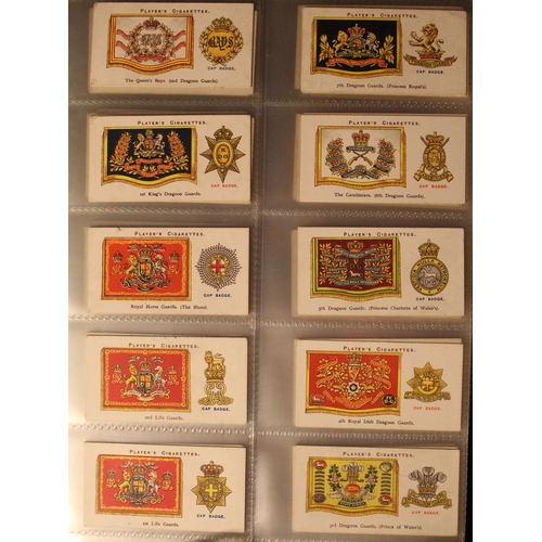 172 - Folder containing a comprehensive and varied collection of cigarette cards incl. Players regimental ... 