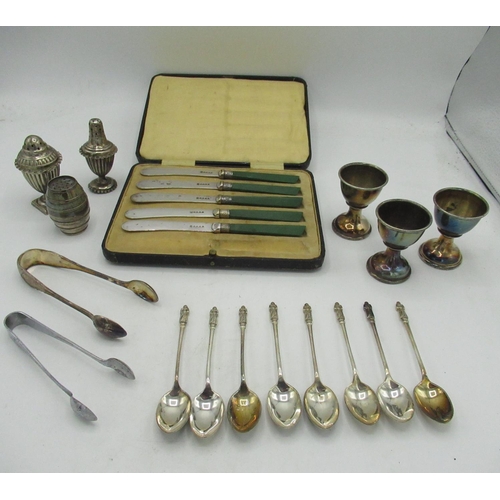 762 - Cased set of five green handled knives, eight apostle tea spoons, salt and pepper set, two pairs of ... 