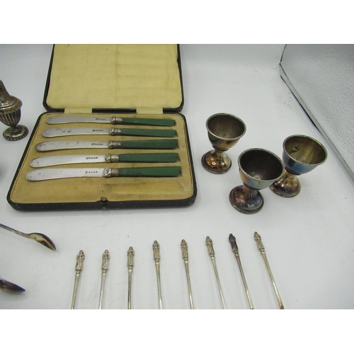 762 - Cased set of five green handled knives, eight apostle tea spoons, salt and pepper set, two pairs of ... 