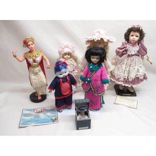 129 - Six large dolls and a small doll in a box