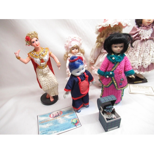 129 - Six large dolls and a small doll in a box