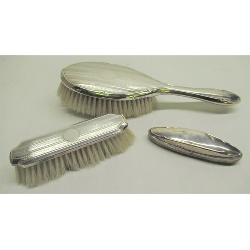 198 - Geo.V hallmarked silver hair brush Birmingham 1929, similar brush Birmingham 1928, silver backed nai... 