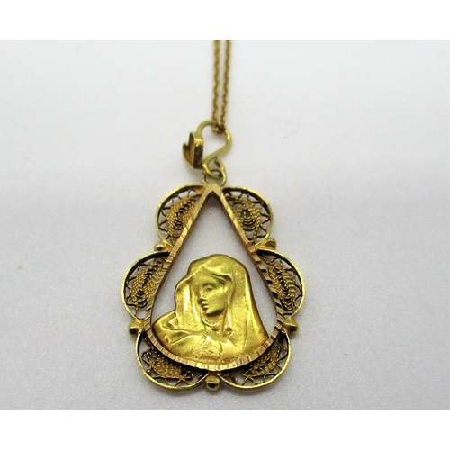 203 - 18ct yellow gold religious pendant in filigree tear drop mount L3cm on a chain with spring ring clas... 